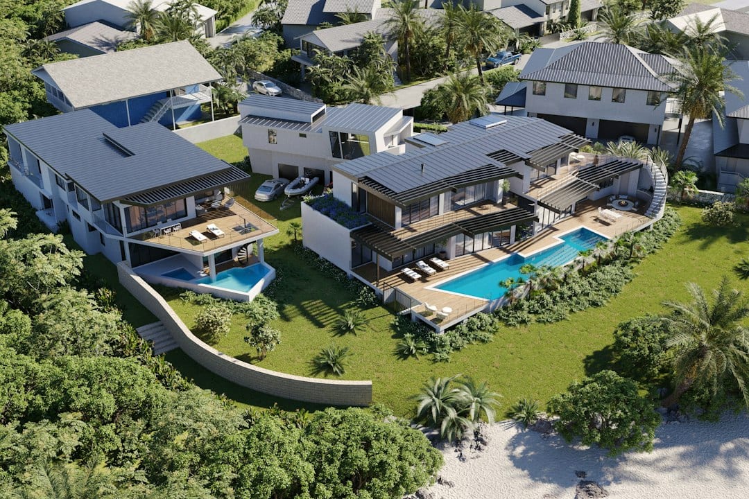 Bright and airy villa living room opening to private pool and ocean view