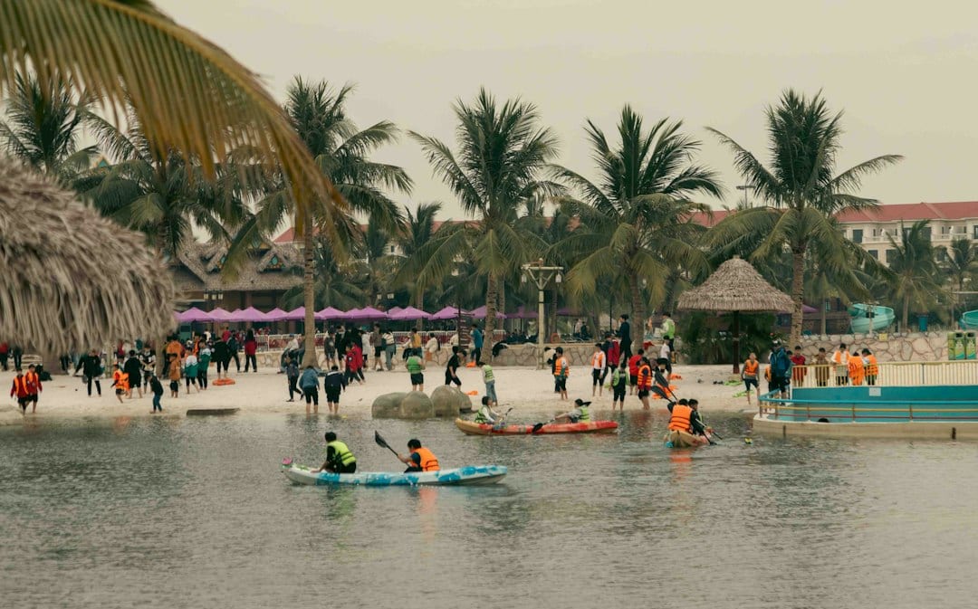 Kayaking in crystal clear turquoise waters near tropical beach