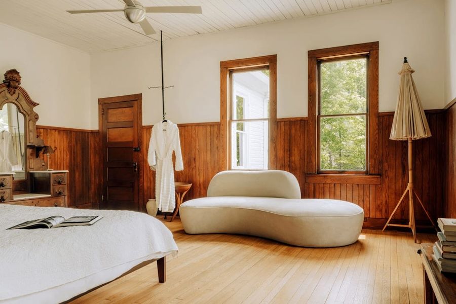 Guest bedroom with queen bed and garden views