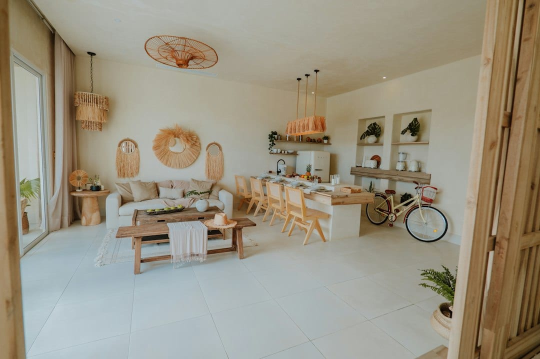 Bright and airy villa living room opening to private pool and ocean view